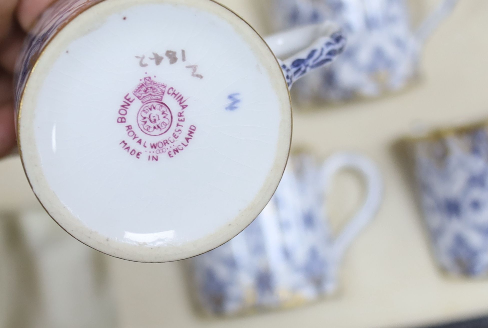 A cased Royal Worcester blue and gilt coffee for 6